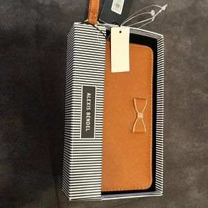 Tan wallet with bow tie